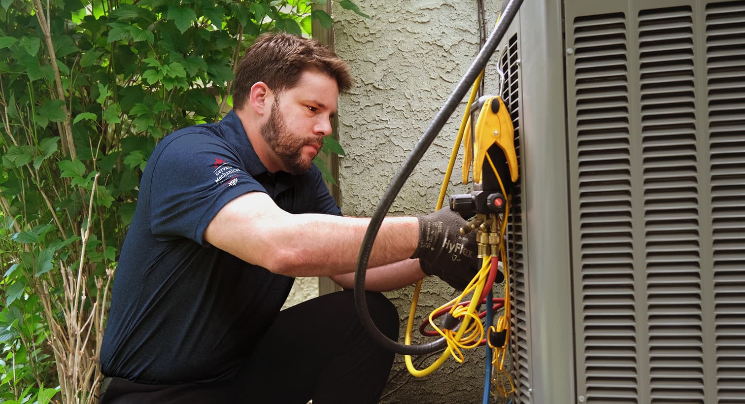 A professional Gervais HVAC technician inspecting an outdoor central air conditioning unit to provide residential AC repair and diagnostic services.