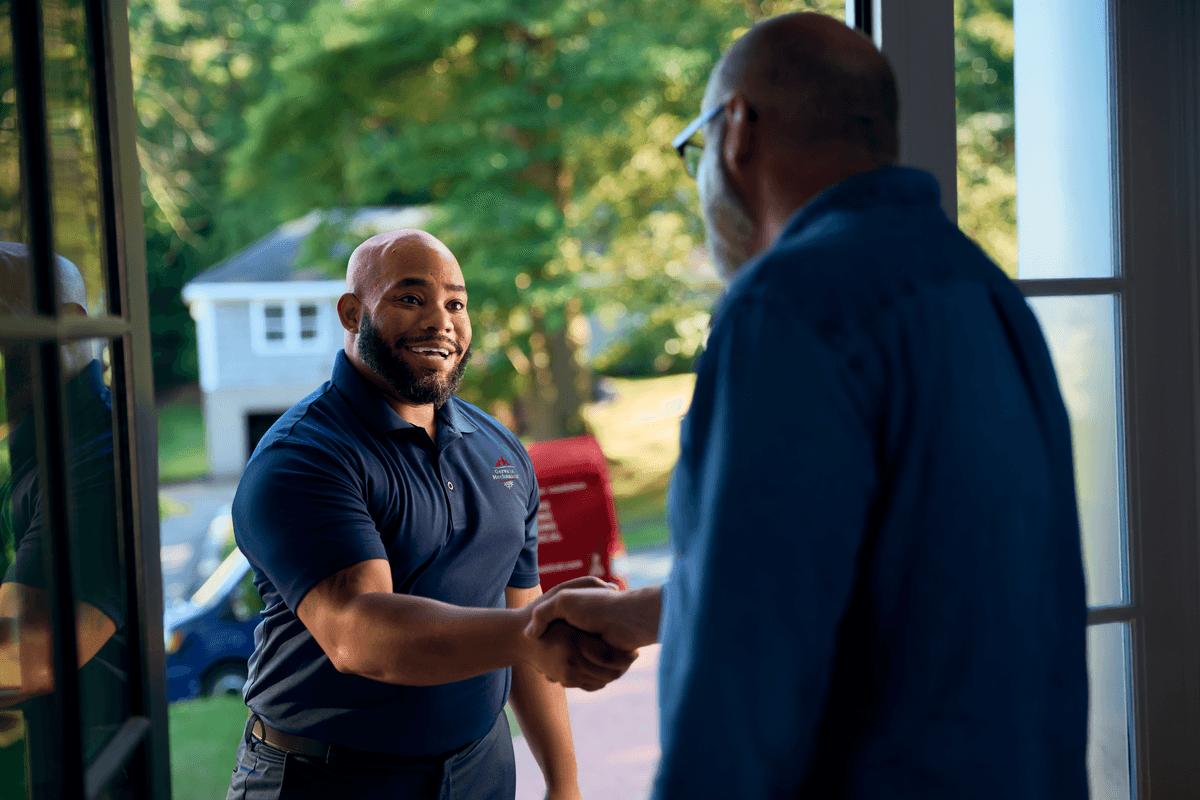 Technician shaking customers hand
