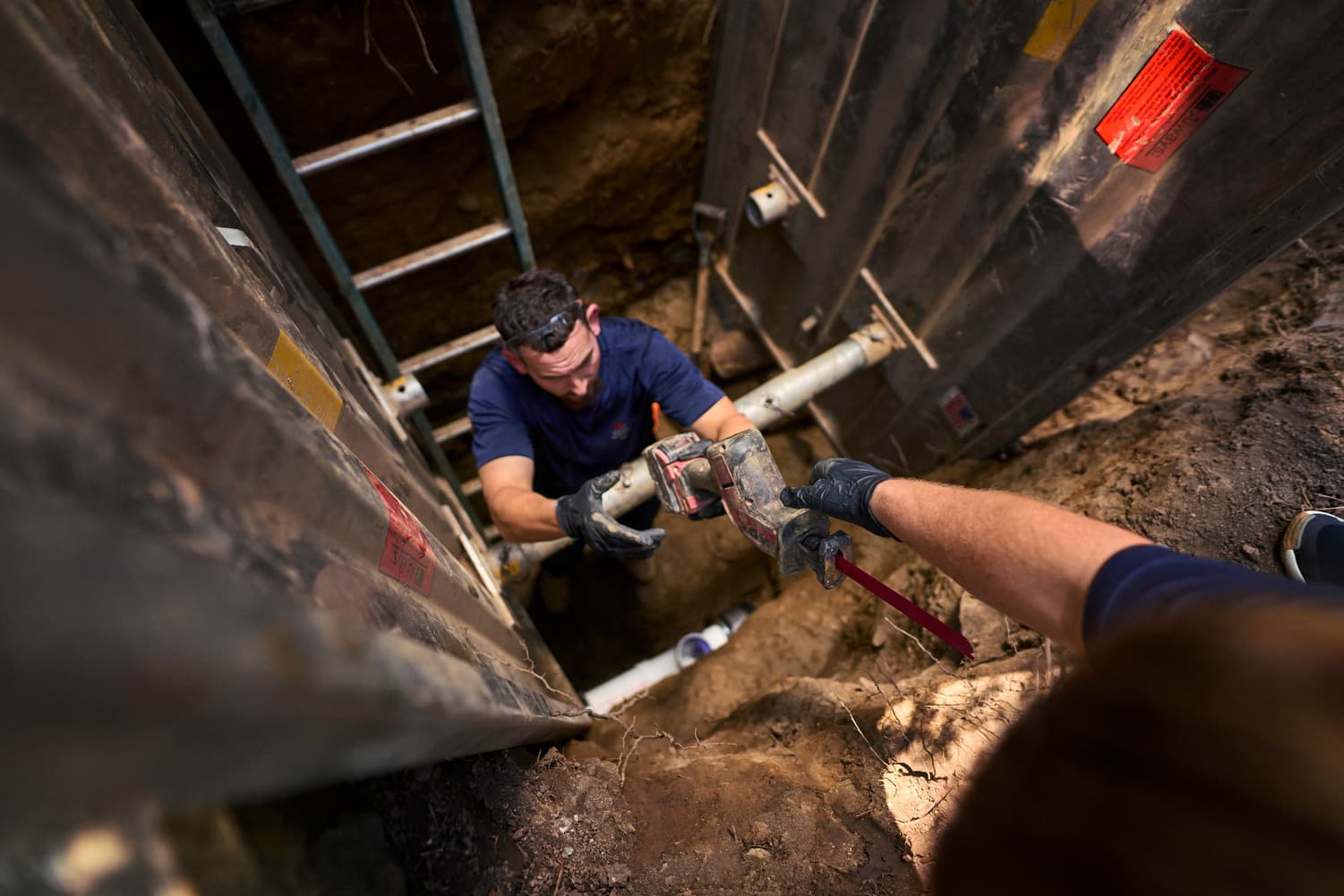 Tech inspecting sewer line